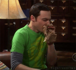 Sheldon from Big Bang Theory is panicking, and breathing into a paper bag.