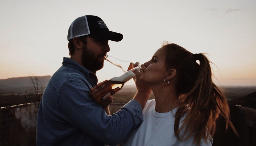 Lauren Henley drinking beer with her fiance