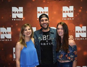 Two fans with Tyler Rich at CMA Fest